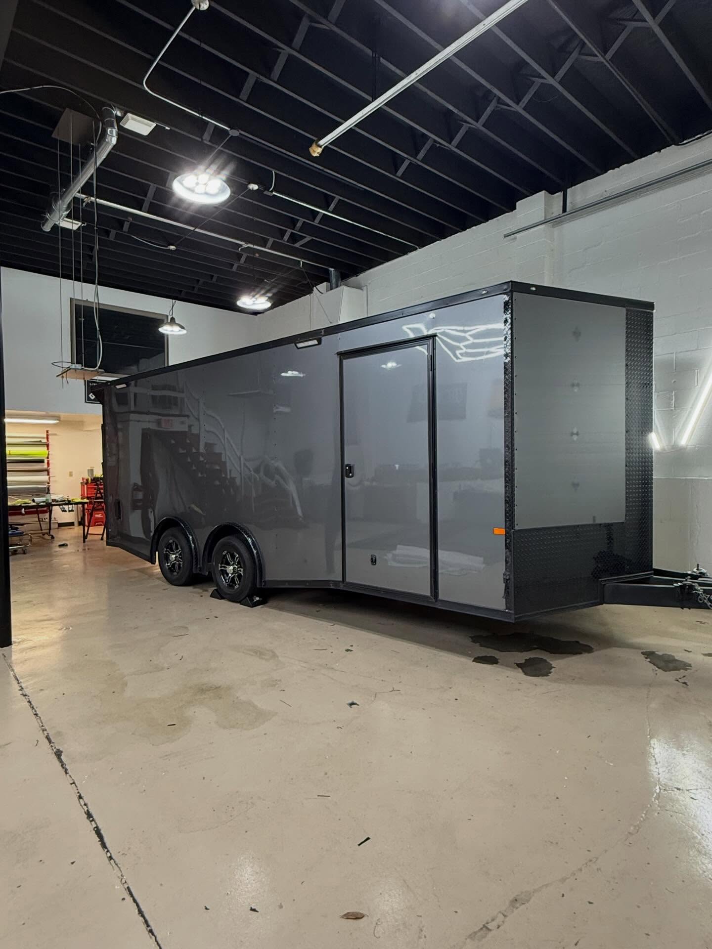 We took this trailer from standard white to a custom Gloss Graphite Metallic you won’t miss on the road. Every bolt was removed and painted black for a clean, cohesive look, then topped off with a ceramic coating for long term protection.Reach out to get your project on the books!#vinylwrap #ᴄᴇʀᴀᴍɪᴄᴄᴏᴀᴛɪɴɢ #worktrailer #greenbaywi #santanasvinylgarage